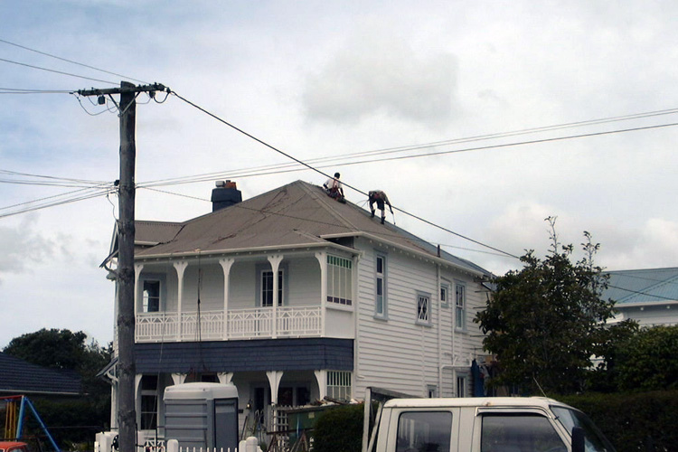 painting iron roof with harness