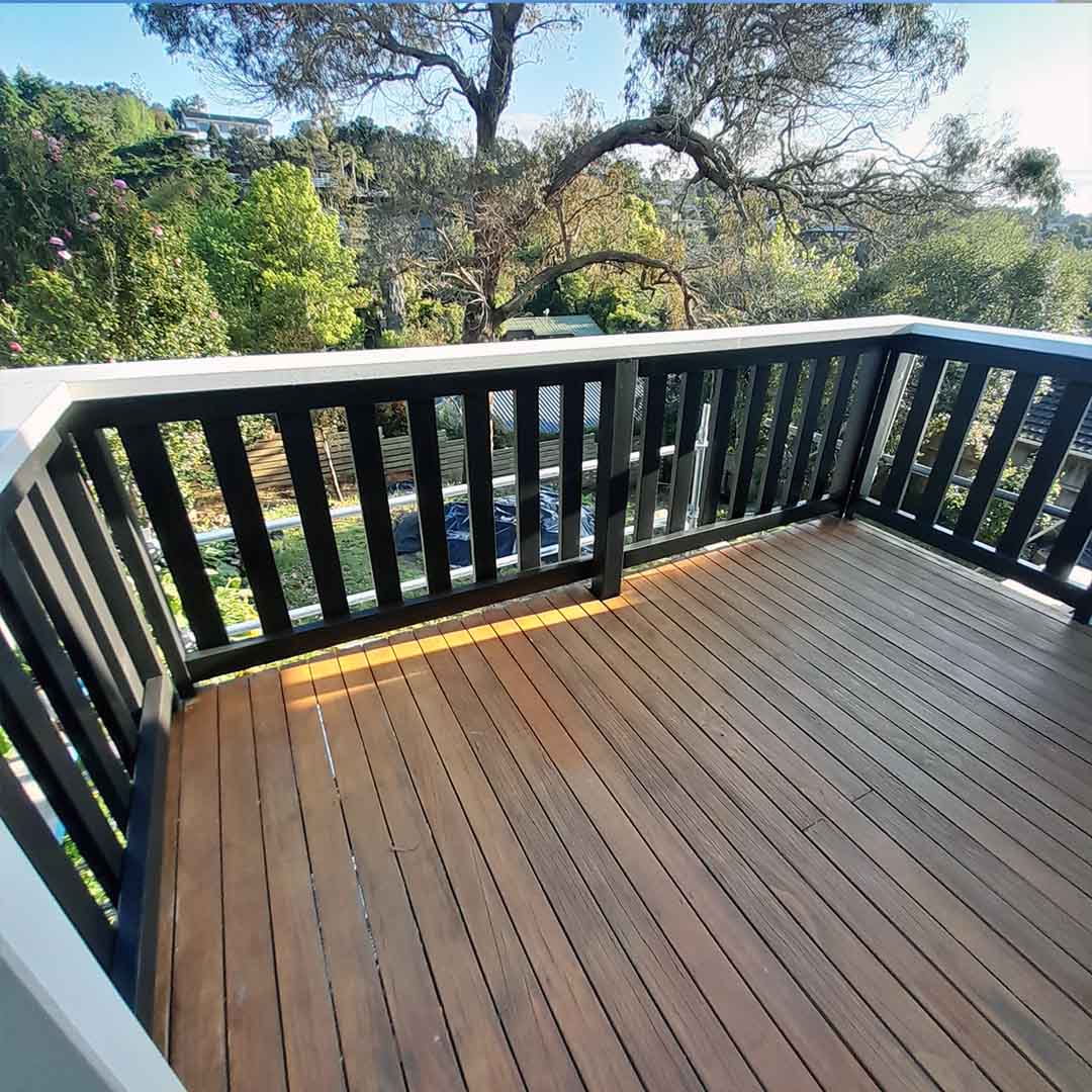 Stained deck and black painted hand rails